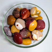 Polished Mookaite Jasper stones in a glass bowl for Mookaite Jasper Hearts H027