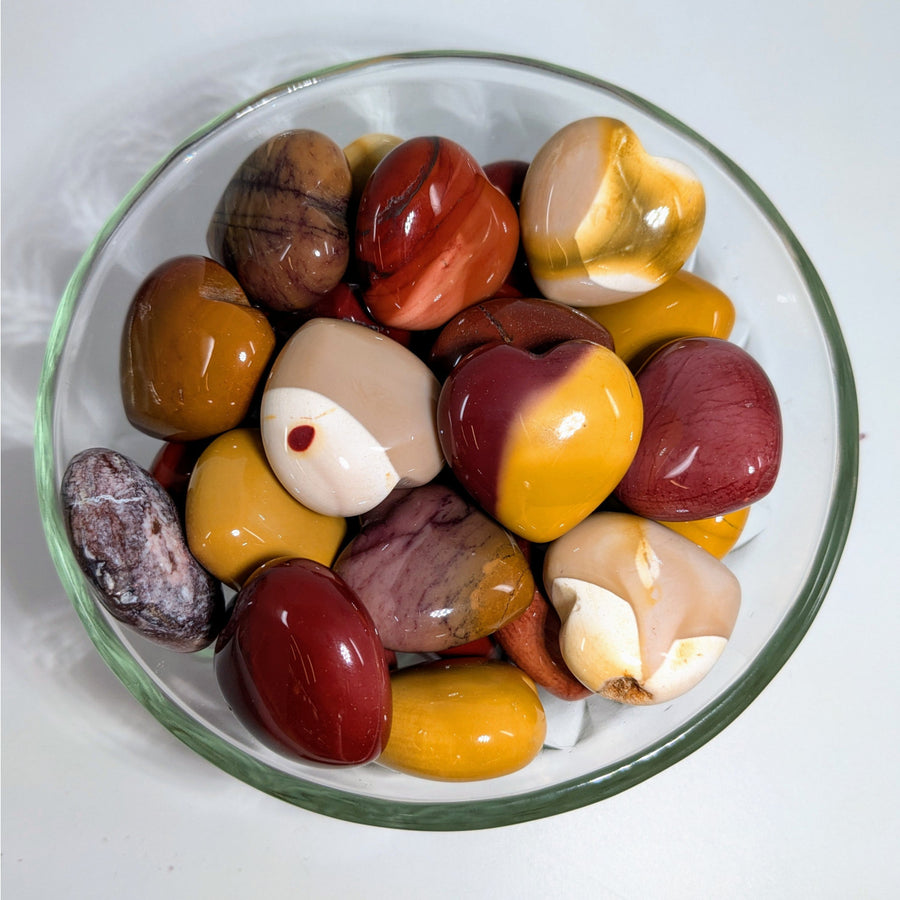 Polished Mookaite Jasper stones in a glass bowl for Mookaite Jasper Hearts H027