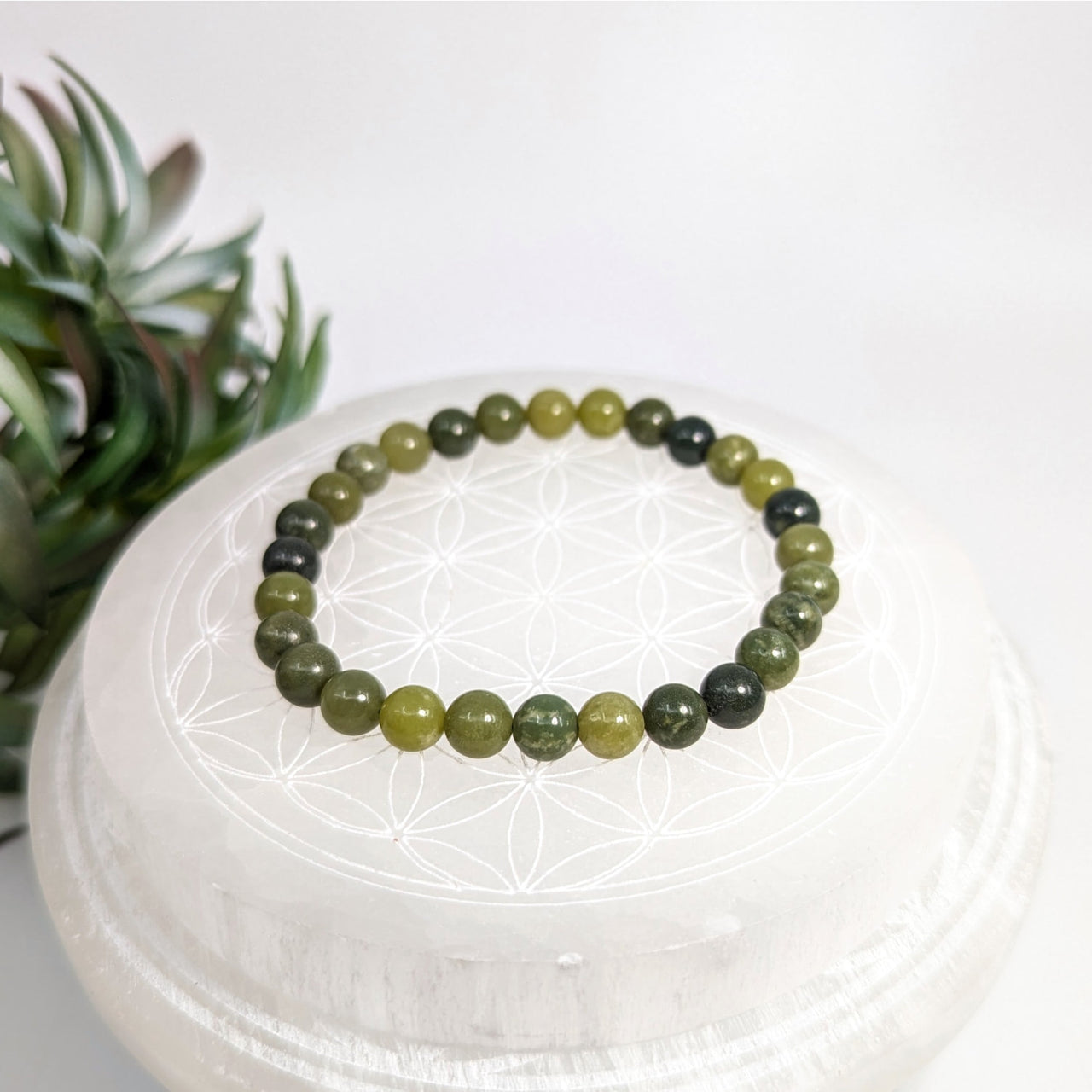 Green beaded bracelet made from Nephrite Jade with 6mm beads and a 7-inch length