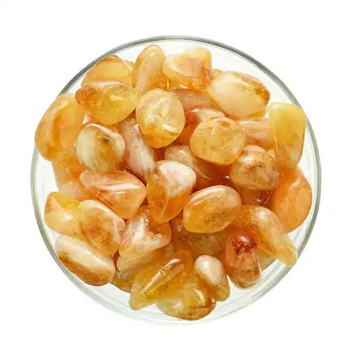 Polished citrine crystals in warm honey-golden tones.