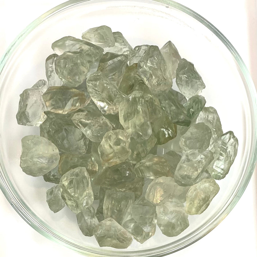 Clear green amethyst rough rocks showcasing translucent green-gray hues