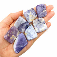 Purple Opal Polished Slice SK8022 with trichroic agate stones in an open palm