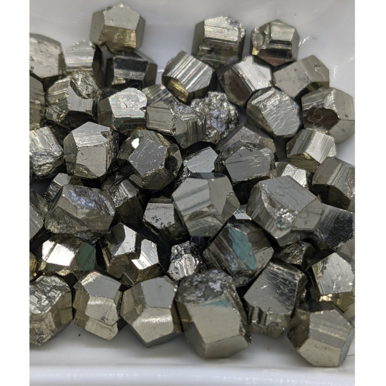 Metallic Pyrite Mini Nugget showcasing unique cubic and dodecahedral crystal shapes