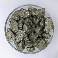 Close-up of Pyrite Rough Stone .75’ in a bowl, 8oz Parcel Bulk Lot #LV3444, on white surface