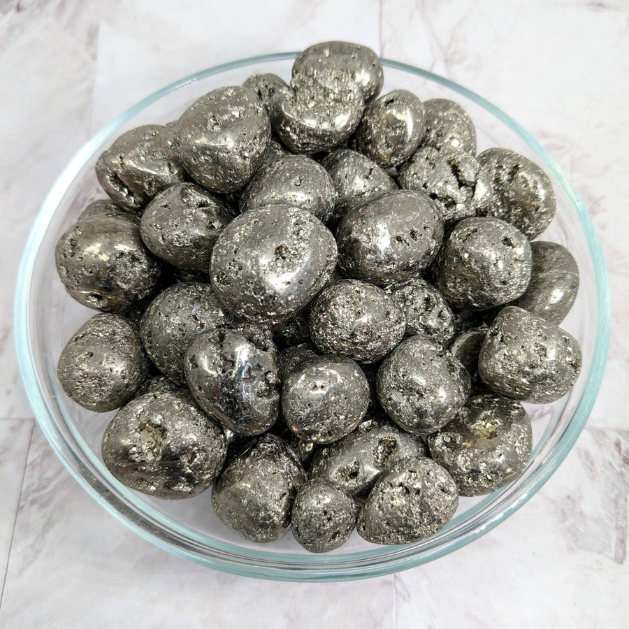 Silver foiled chocolates in a bowl displayed with Pyrite Round Tumble Stone #LV2260