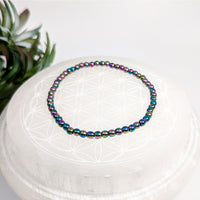 Iridescent beaded bracelet in rainbow colors with hematite 4mm beads, 7 inches long