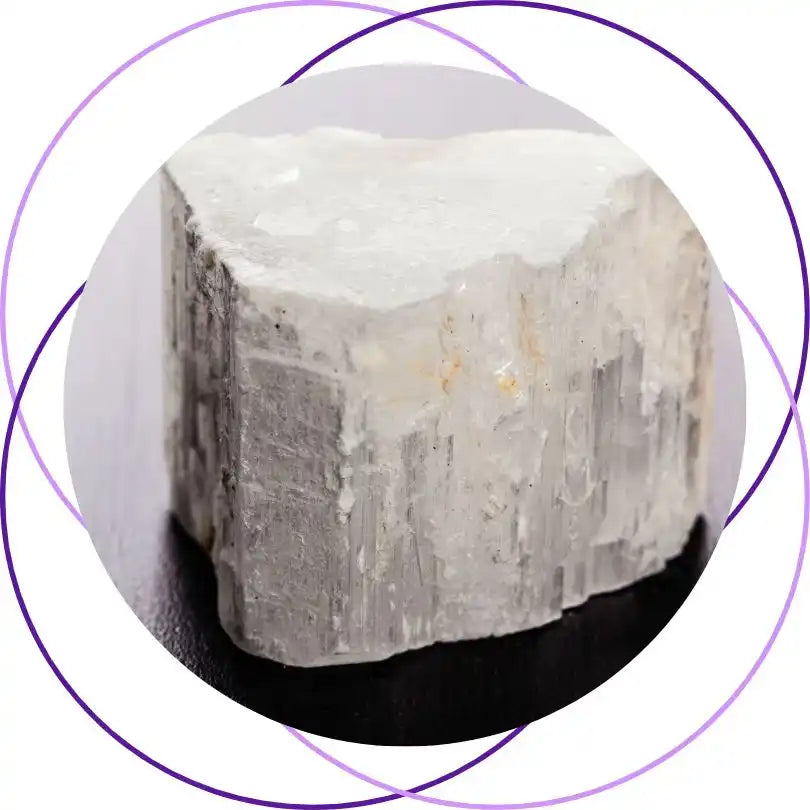 Raw chunk of selenite crystal with a striated, pearly white surface.