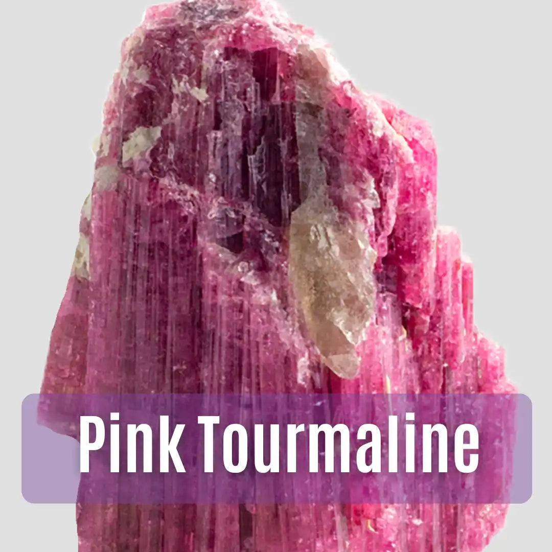Raw pink tourmaline crystal with vertical striations and a vibrant magenta-pink color.