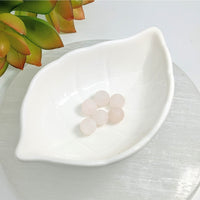 White leaf-shaped ceramic dish with pale pink Rose Quartz 8mm frosted round beads