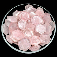 Bowl filled with rose quartz gems from the Rose Quartz Gem Cut Hexagon Star Carving SK5982