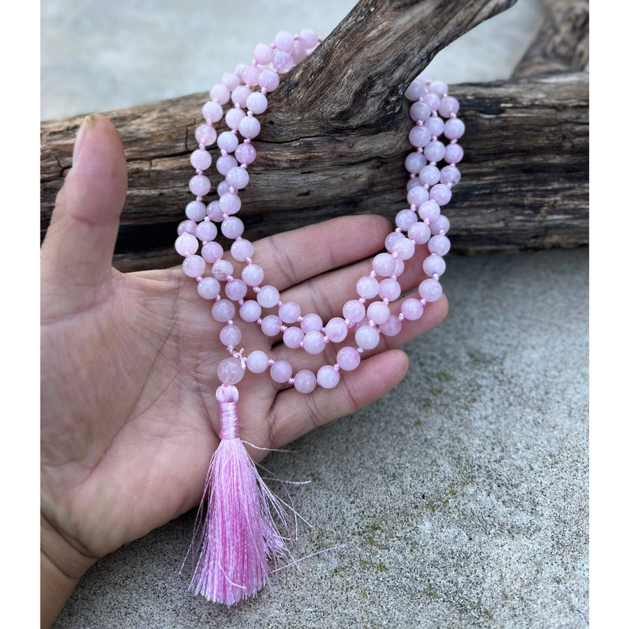 Pink beaded Mala necklace with tassel, featuring Rose Quartz 108 beads for meditation