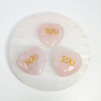 Pink heart-shaped stones with gold lettering for Rose Quartz Heart I Heart U carving