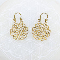 Gold finish earrings featuring a sacred geometry honeycomb pattern with hook attachments