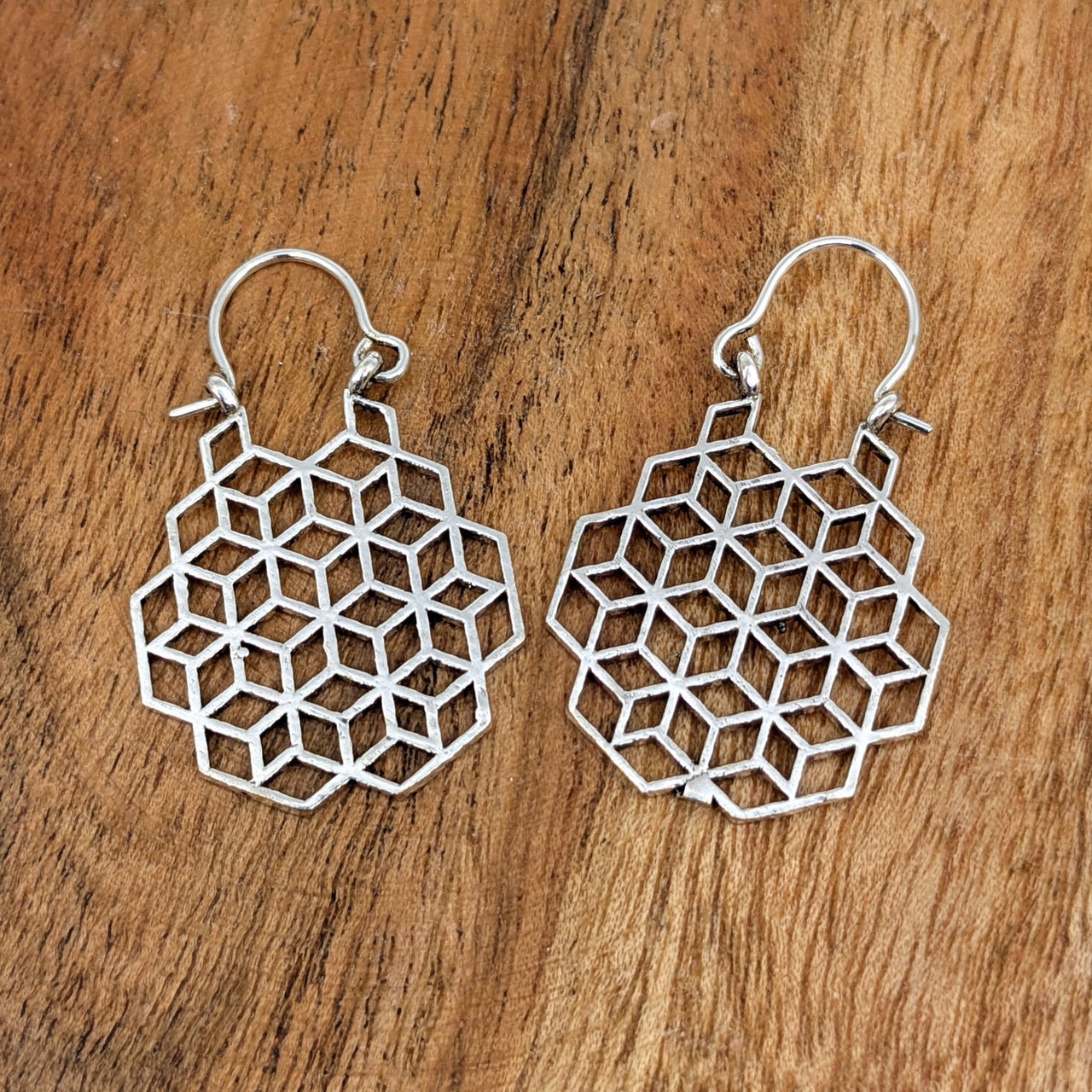 Silver geometric earrings with honeycomb pattern, part of Sacred Geometry 1’’ Brass Earrings