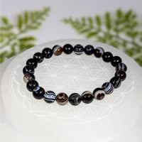 Polished sardonyx 7-inch 8mm bead bracelet BC0936 with black agate swirls