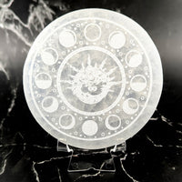 Translucent 4’’ selenite round plate with etched dragon and moon phases