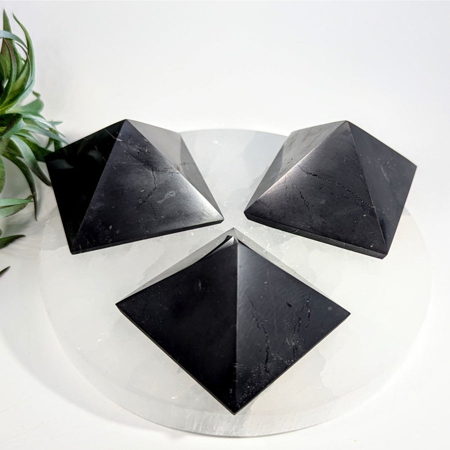 Three black obsidian pyramids in the Shungite 2 inch Pyramid LV8649 product display