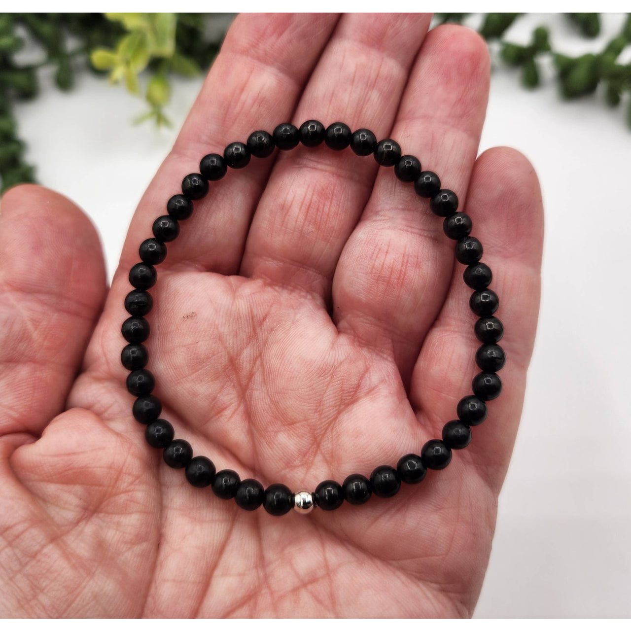 Black beaded Shungite bracelet with silver accents for protection and EMF control