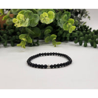 Black beaded Shungite bracelet with silver accents for EMF protection and control