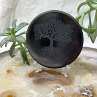 Round black Shungite tile with engraved Tree of Life design, 3.9 inches diameter