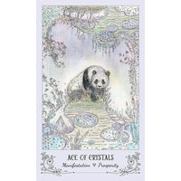 Panda bear on table with Spiritsong Tarot Deck by Paulina Fae in the background