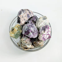 Raw Striped Fluorite Rough crystals in a glass bowl for mineral collectors