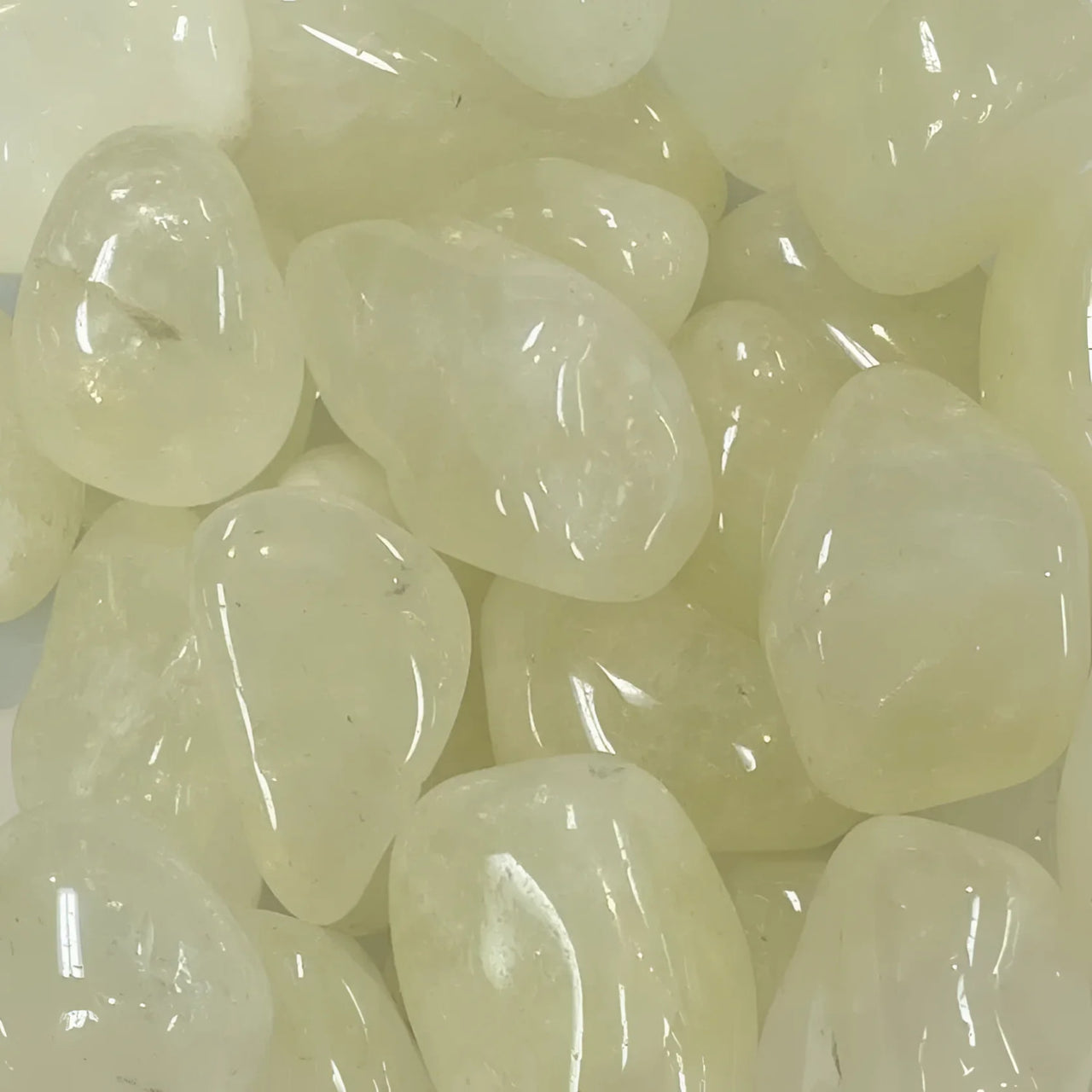 Translucent white jelly beans clustered with Sulphur Quartz Tumbled #T442 for rewards