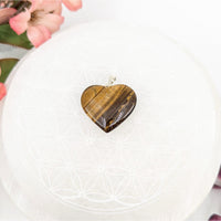 Heart-shaped Tiger’s Eye pendant displayed in the Tiger’s Eye 1 inch Heart Pendant #LV7963