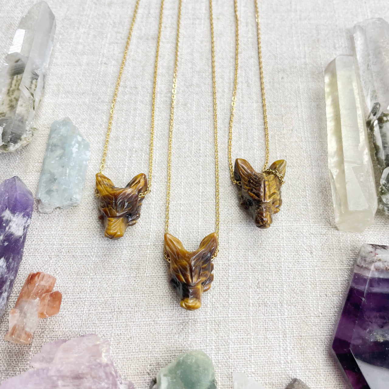Three gold tiger eye carved wolf head pendants on 18’’ necklaces LV9098