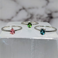 Colorful tourmaline gems on marble block highlight Tourmaline S.S. Faceted Ring #LV3879