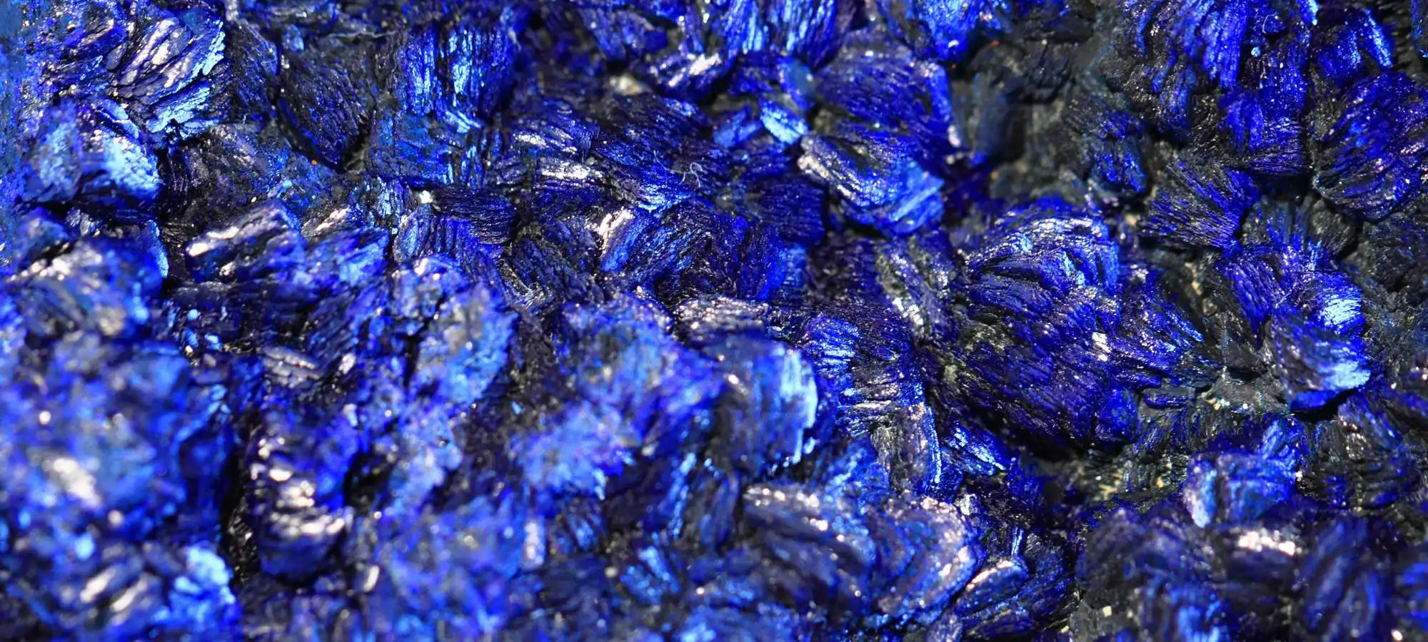 Vibrant blue azurite mineral crystals with metallic luster.