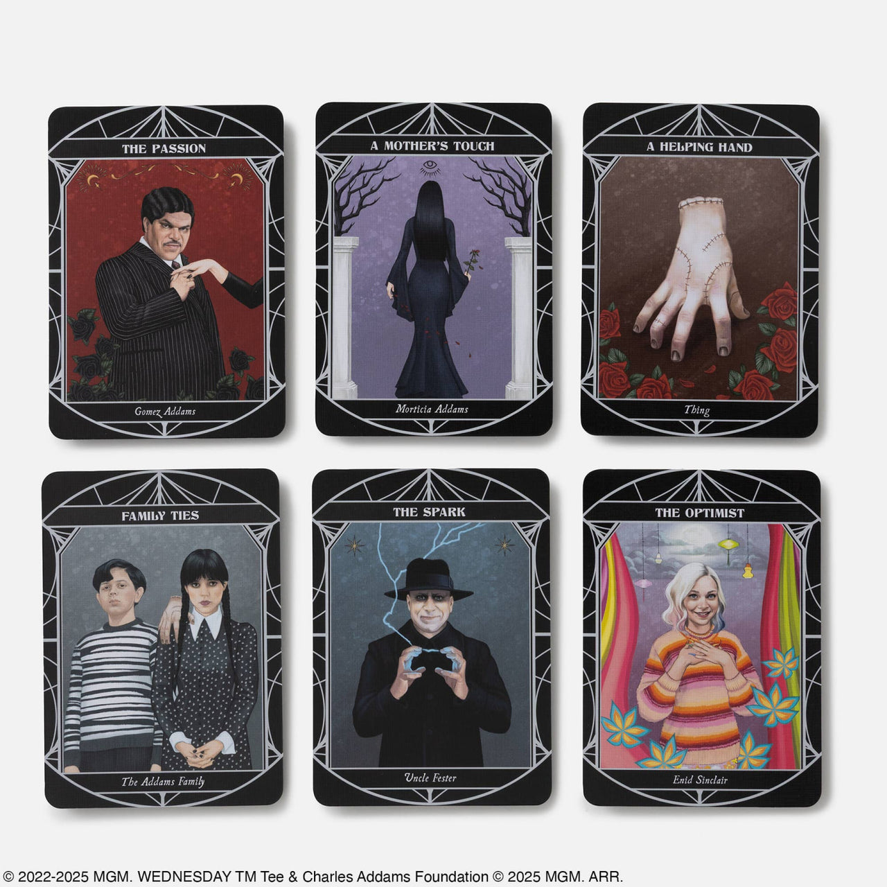 Set of six black-bordered tarot cards from wednesday official oracle deck featuring characters with gemstone details