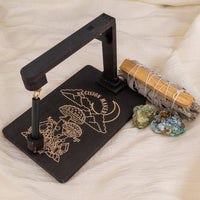 Black decision-making pendulum board from Wooden Decision Maker, Death Moth, Seraphim & Mushroom