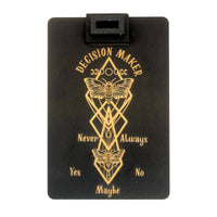 Black wooden decision-making board with a moth and geometric designs for thoughtful choices